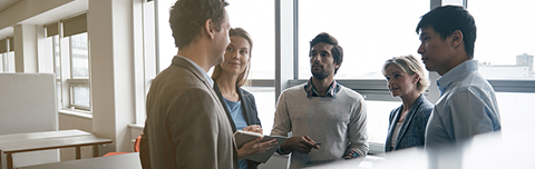 Group of professionals discussing 403(b) plans. Group of professionals discussing 403(b) plans.